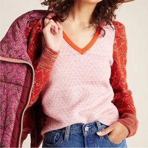 Fun pink and red Anthropologie sweater with puffed sleeves.